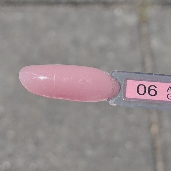 Quida Acrylgel 6 Adria - oudroze acrylgel tube 60gr in het zonlicht, textuur en consistentie zichtbaar