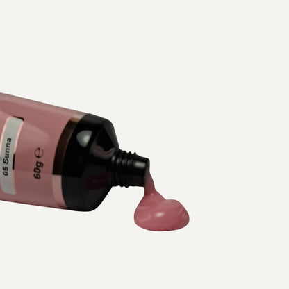 Quida Acrylgel 05 Sunna 60g tube met warm roze gel die uit de opening komt