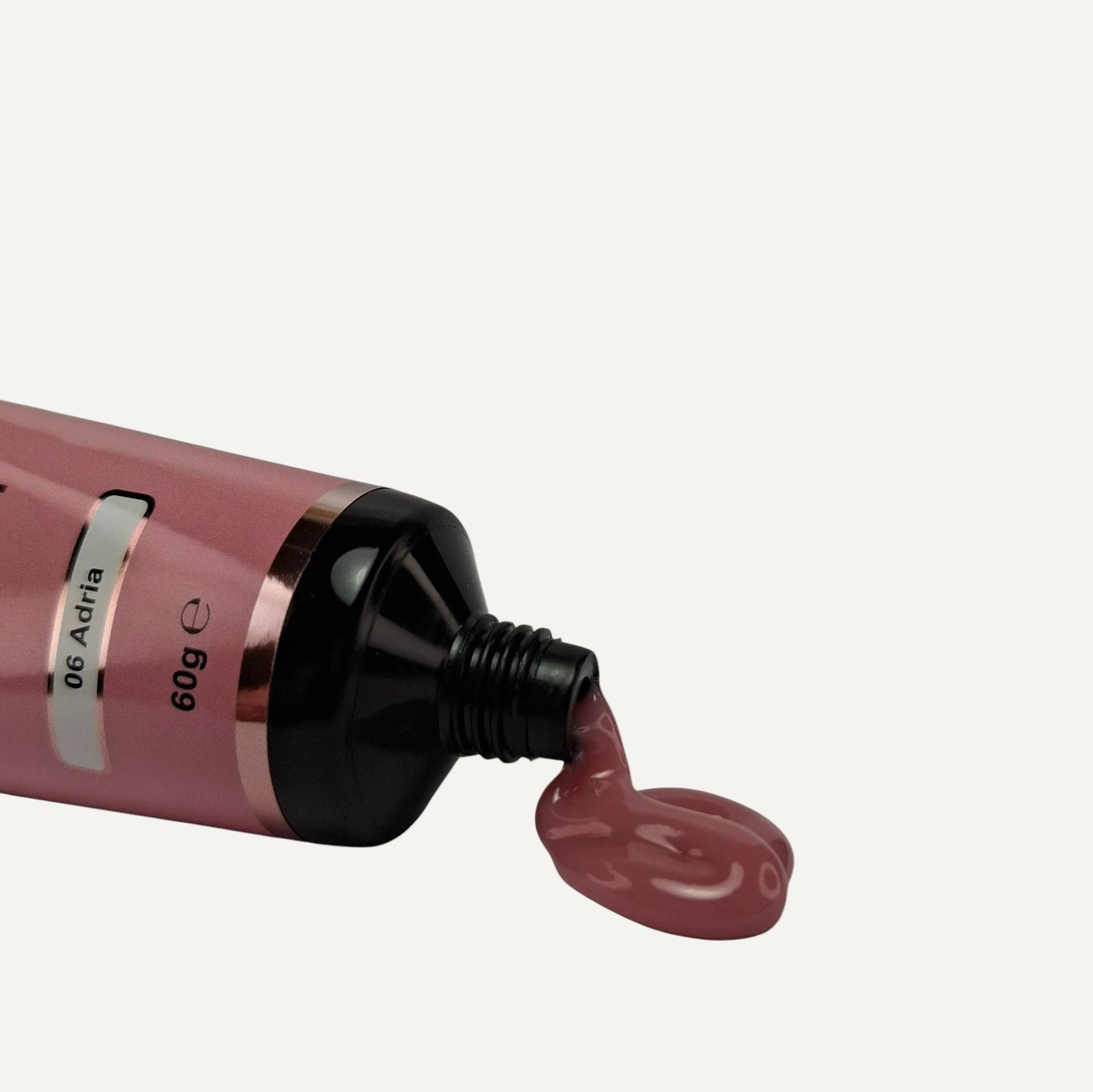 Quida Acrylgel 06 Adria 60g tube met oudroze gel die uit de opening komt